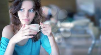 Stylish woman with an aromatic coffee in hands