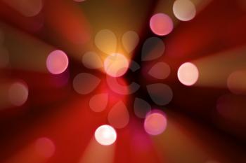 red spots of holiday lights bokeh with rays