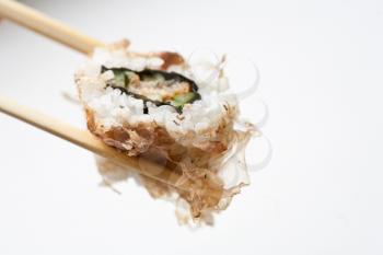 Sushi with chopsticks isolated on a white background