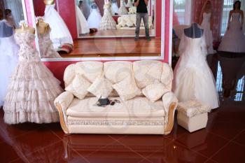 Weddings dress on a mannequin and sofa