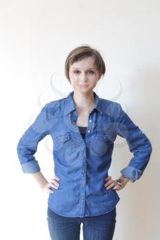 Pretty young blond woman in jeans shirt - copyspace