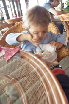 boy child cute eating ice cream in cafe