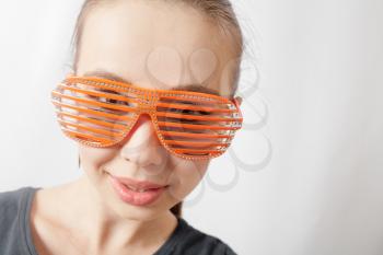 portrait of a beautiful young sexy woman wearing party sunglasses. Smiling face, having fun