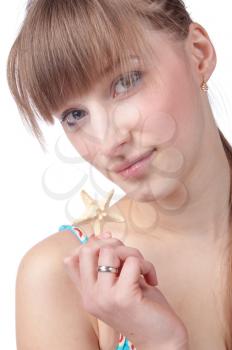 female part face closeup, studio shot with seastar