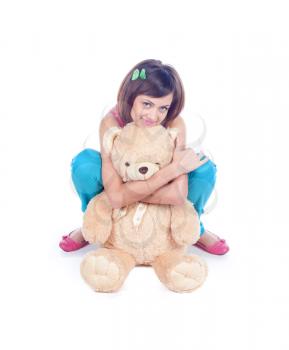 Fashion girl posing with teddy on white background