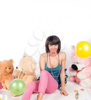 Pretty young woman in pink with teddy