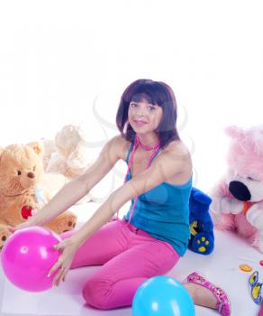 Pretty young woman in pink with teddy