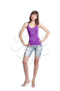 Full length portrait of a confident young female standing on white background