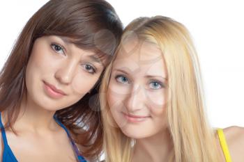 two close frends - brunette and blonde women closeup face shot on white background, Girls in calm and happy state