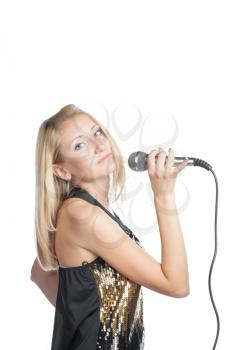 blonde woman holding a retro microphone on white background