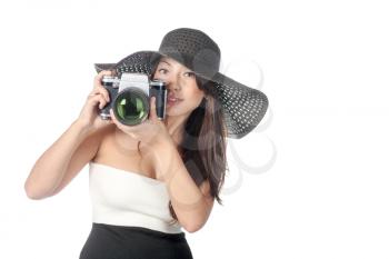 Young caucasian woman looking like Lady vintage weared with old film camera with very big lens isolated over white background