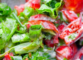 delicious green salad with lettuce and tomatoes with various garnish