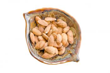 Almonds. bowl full of almond nut on white with shadow. Almonds in a bowl