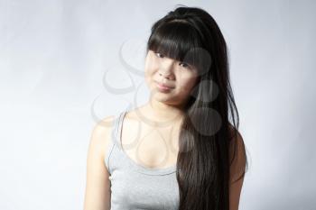 brunette japan girl studio shot on white smiling