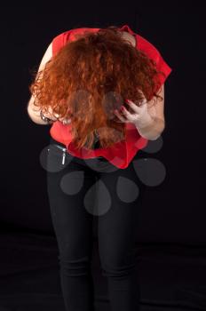 beautiful redhead girl torso shot on black