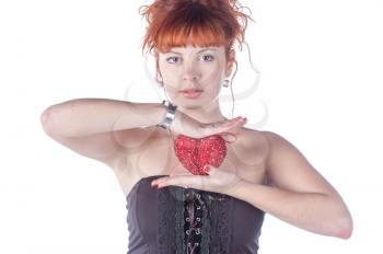 beautiful redhead caucasian girl with heart in hand on white background