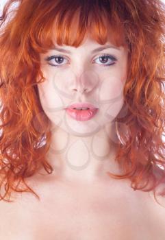 portrait of redheaded beautiful girl on white