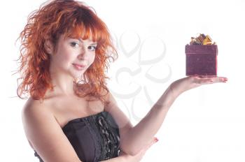 pretty red-haired girl with giftbox on white