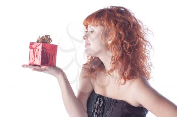 pretty red-haired girl with giftbox on white