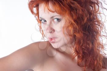 Portrait of beautiful young woman with red hair closeup on white
