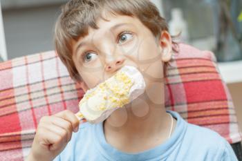 Cute little boy eating ice cream