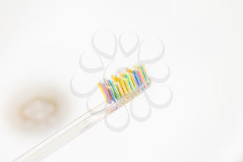 Toothbrush with Water Drops on White sink