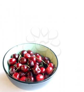 Crockery with ripe cherries