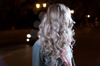 Blonde young girl, waves of the hairs, backside view, no face