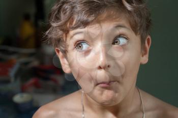 surprised 7 years old boy make funny faces