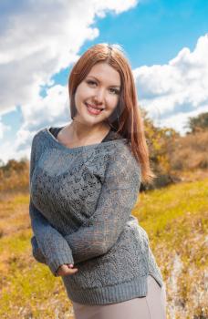 redhead weared gray sweater outdoors at autumn