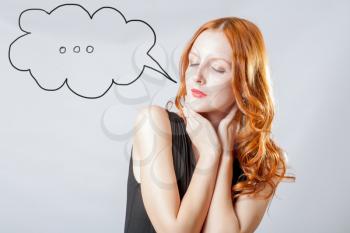 closed eyes portrait of a young girl with red hair with speech  bubble