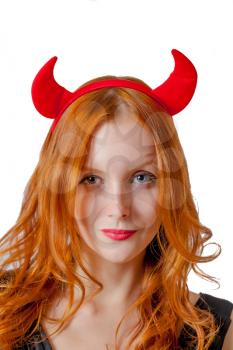 Vertical shot of redhead girl with red  horns looks like pretty Devil? isolated on white
