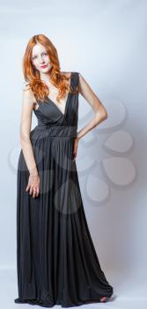 redhead women  full body in black dress,studio shot