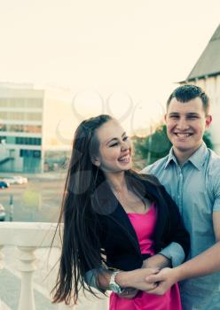 Young couple is very happy together. Outdoor colorized shot