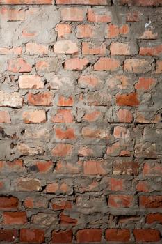 Old damaged aged Brick wall closeup backdrop. Red brick wall closeup background. Closeup of old brick wal