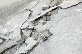 Broken cracked asphalt pavement in Russia