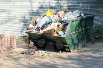 Overfilled trash dumpster in ghetto neigborhood in Russia.