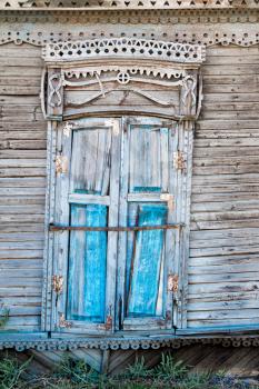 Vintage window of an old wooden house in Russia