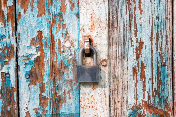 Old iron lock on weathered door in Astrakhan, Russia