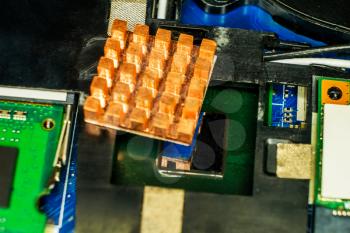 New copper cooling element on motherboard. Copper heat sink.
