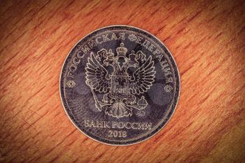 Modern russian coin revers with seal of Bank of Russia depicting twin headed eagle with heraldic signs. Translation from russian - Russian Federation. Bank of Russia, 2018