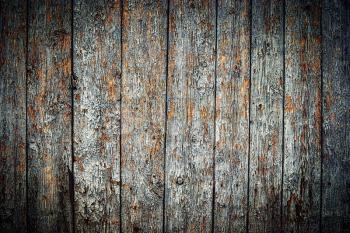 Weathered wood texture peeling paint. Background old panels with harsh vignette, copyspace.