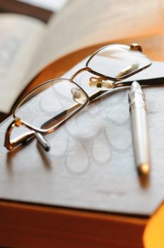 Royalty Free Photo of Glasses on a Notepad