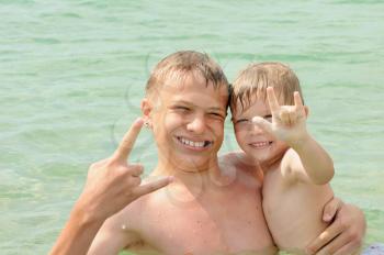 Royalty Free Photo of Two Brothers Swimming