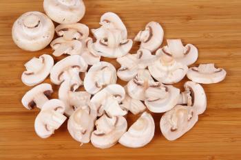 Royalty Free Photo of Mushrooms on a Cutting Board