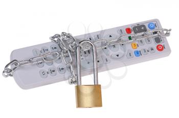 The television remote control is closed by the padlock with a chain isolated on white background