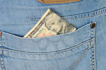 Royalty Free Photo of Ten Dollars in Pant Pockets