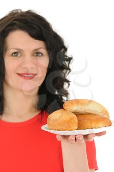 Royalty Free Photo of a Woman Holding a Plate of Bread