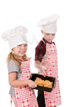two children in the chef's hat isolated on white background