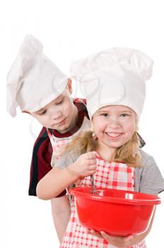 two children in chef's hat isolated on white background